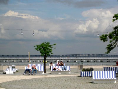 People Resting On Benches