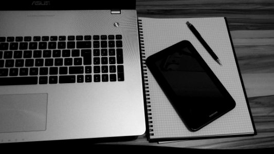 Laptop Smartphone And Notebook On Table photo