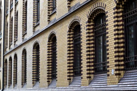 Brick Wall And Barred Windows