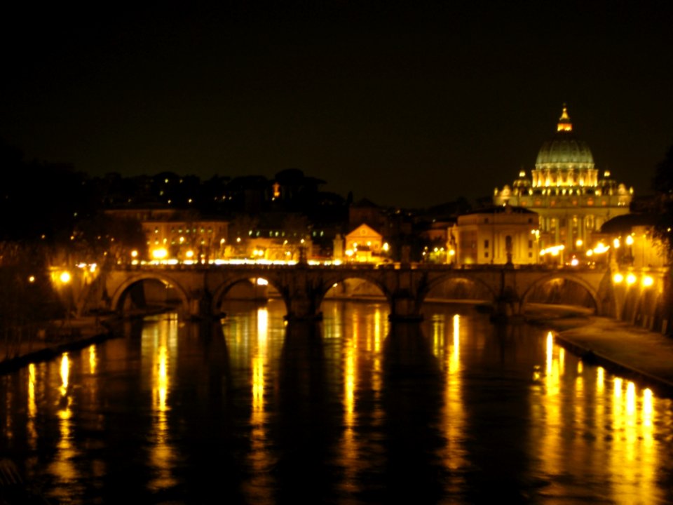 Sant-angelo-bridge-and-san-pietro-basilica-at-night