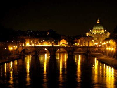 Sant-angelo-bridge-and-san-pietro-basilica-at-night