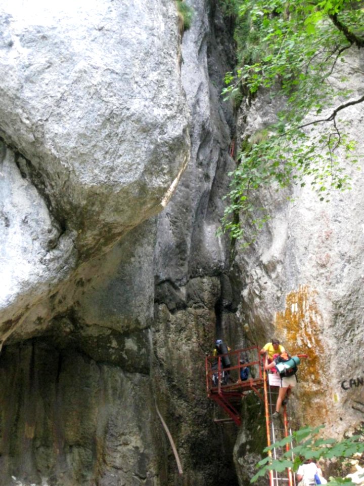 People-climbing-on-canyon-entrance
