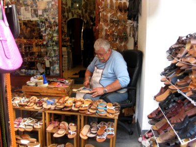 Man Working In Shoe Shop