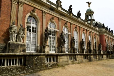 Statues Framing Arched Windows