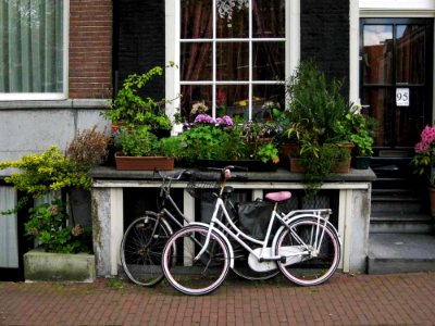 Bicycles Parked In Front Of Canal House photo