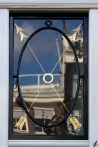 Window Decorated With Two Gilded Arrows