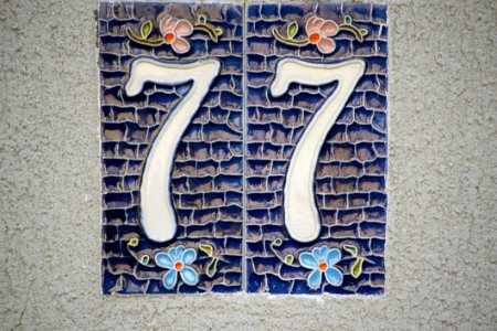 Picture Of A Ceramic House Numbering Plate With Floral Motifs