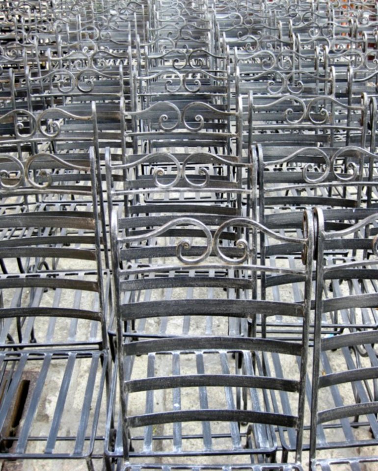 Rows-of-empty-iron-chairs