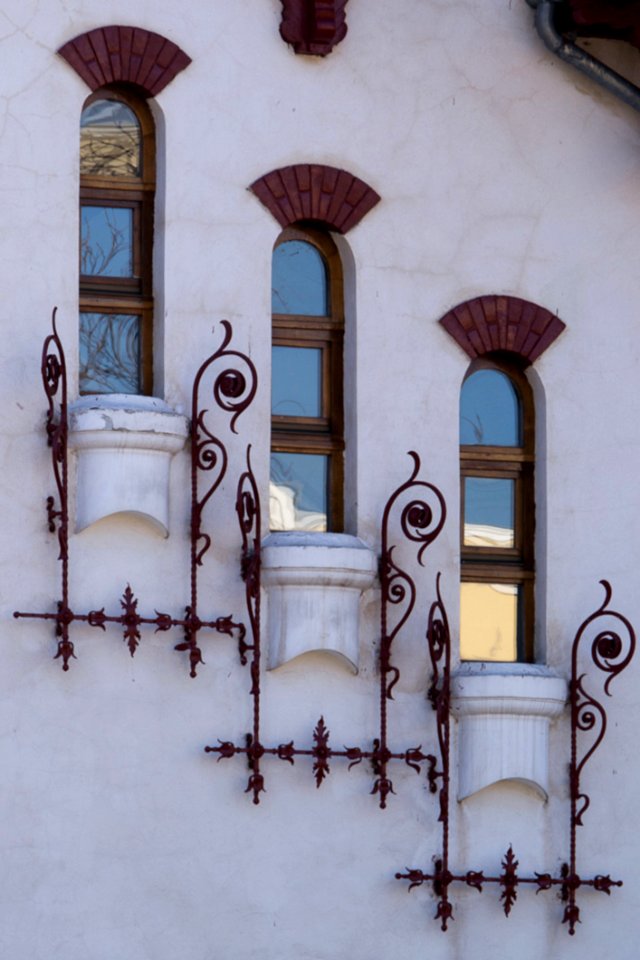 Image Of A White Villa Facade With Descending Narrow Windows