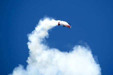 A Russian Sukhoi Su-31 Aerobatics Aircraft Performing An Inside Loop While Leaving Smoke Traces