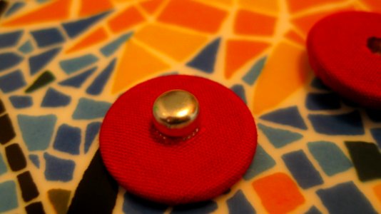 Red-button-on-ceramic