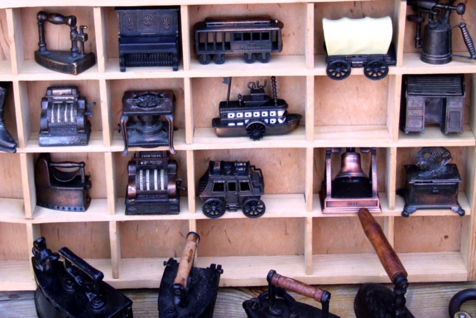 Metal-miniatures-on-wooden-shelf