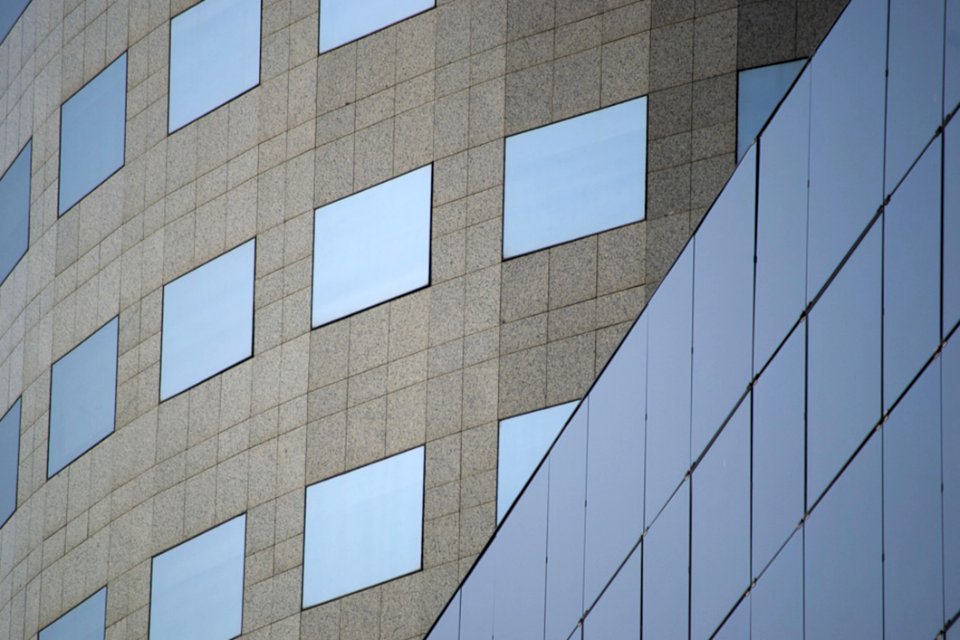 Curved Office Building In Commercial Area Of A City Sleek Straight Lines Are Combined With Rounded Shapes To Create An Amazing Lo