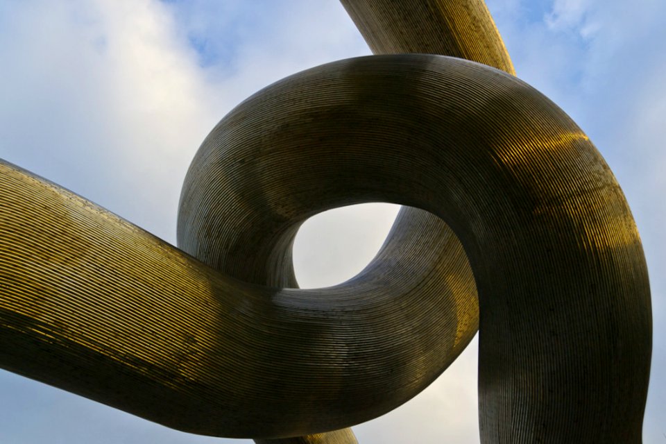 Intertwined Metallic Tubes Sculpture