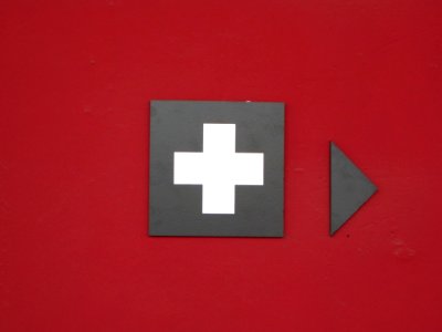 Help-station-sign-on-burgundy-painted-wall