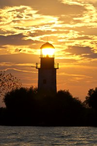 Lighthouse Lit By Setting Sun photo