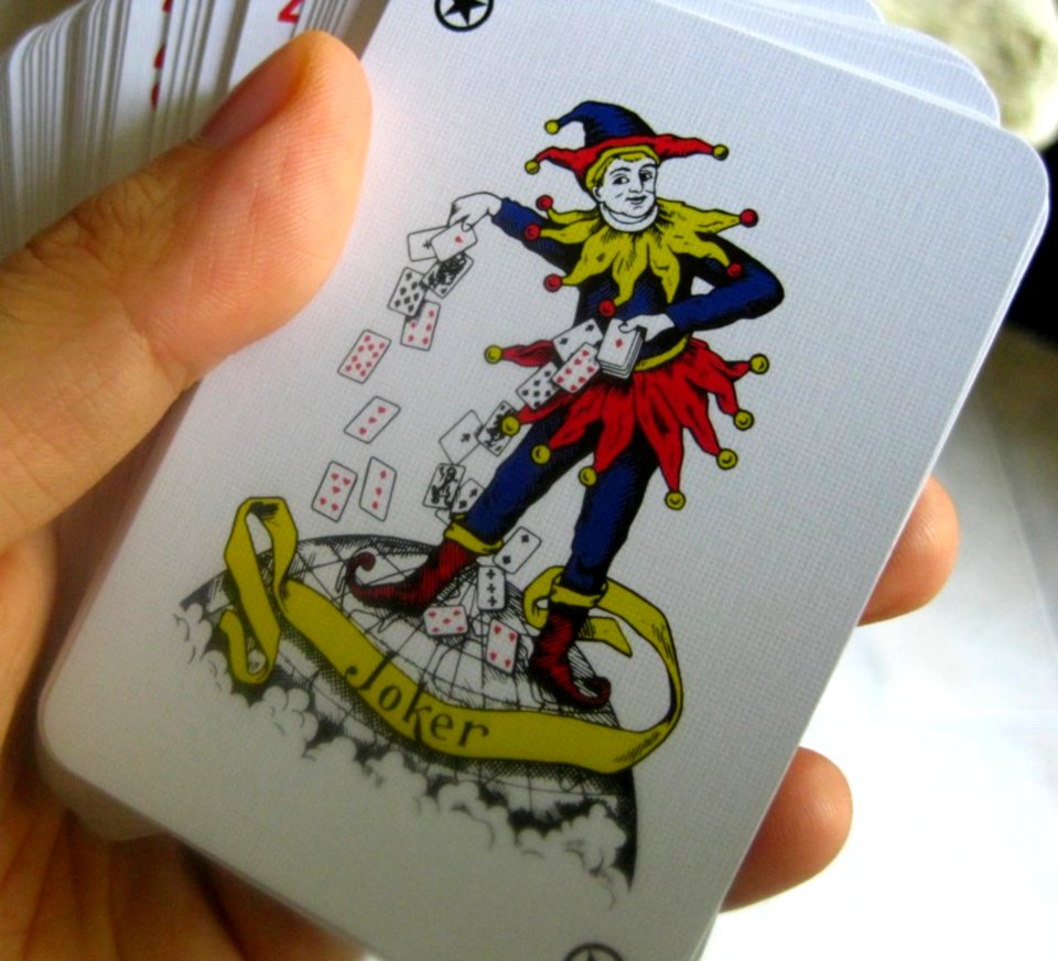 Hand-holding-pack-of-cards