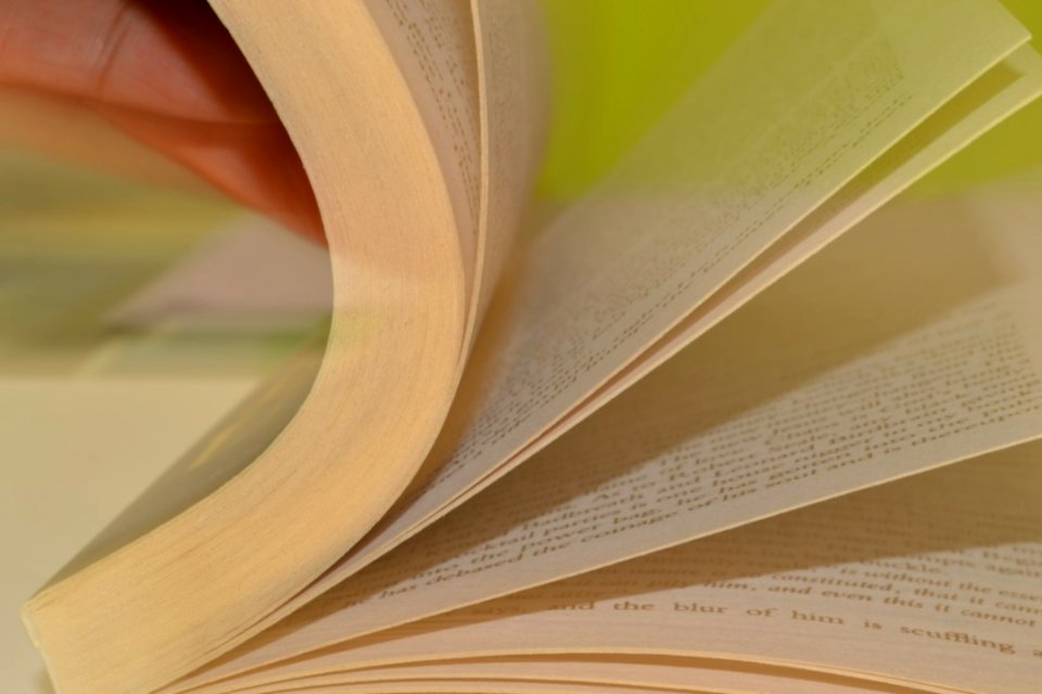 Hand-browsing-through-book