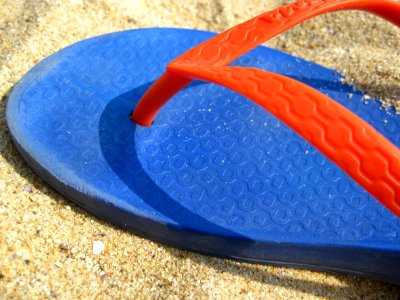 Colorful-flip-flop-on-sand