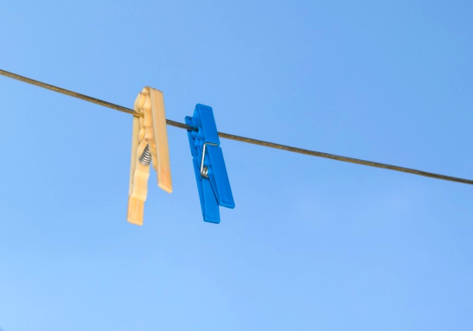 Blue-and-yellow-pegs-on-clothes-line