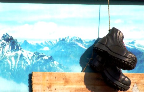 Boots-hanging-on-sports-shop-signboard