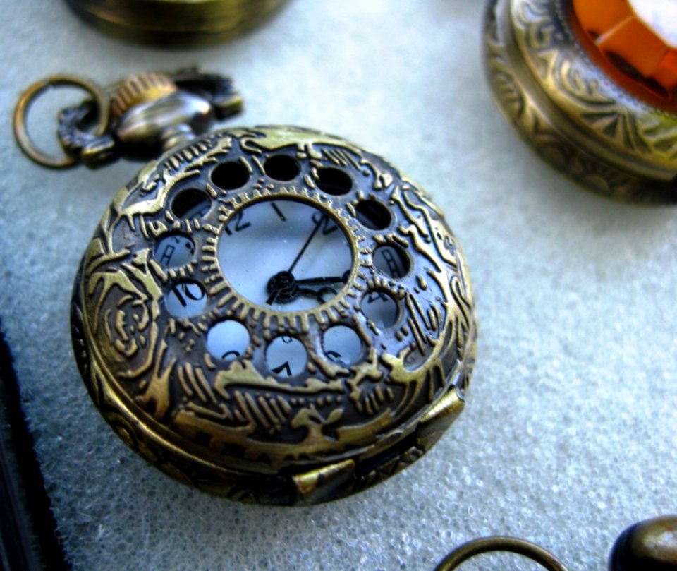 Antique-pocket-watch-with-ornamented-bronze-casing