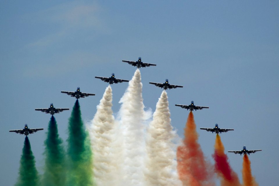 Frecce Tricolori Flying In V Formation And Leaving Italian Flag Colored Smoke Trails