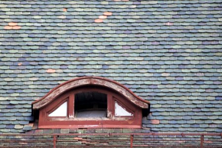 Photo Of A Semi Round Garret Opening On A Shingled Roof
