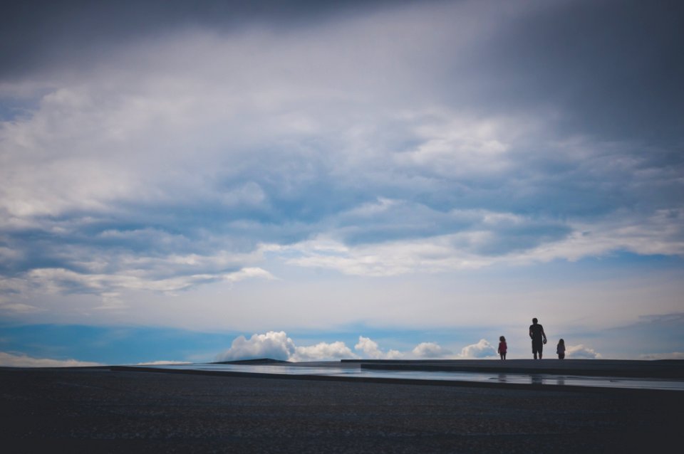 Father With Children On Beach