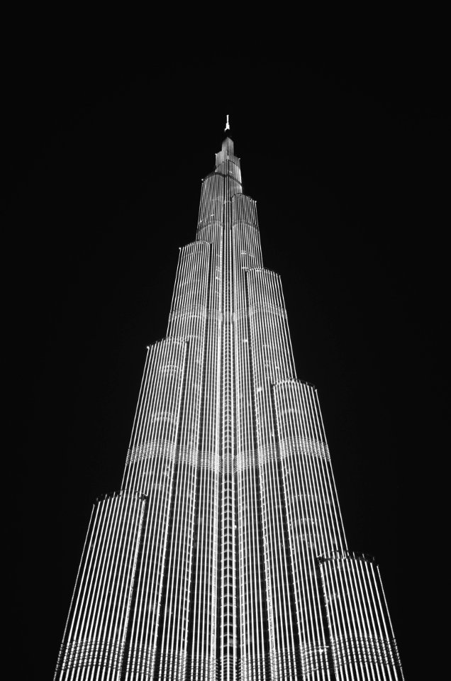Low Angle View Of Skyscraper Against Sky At Night