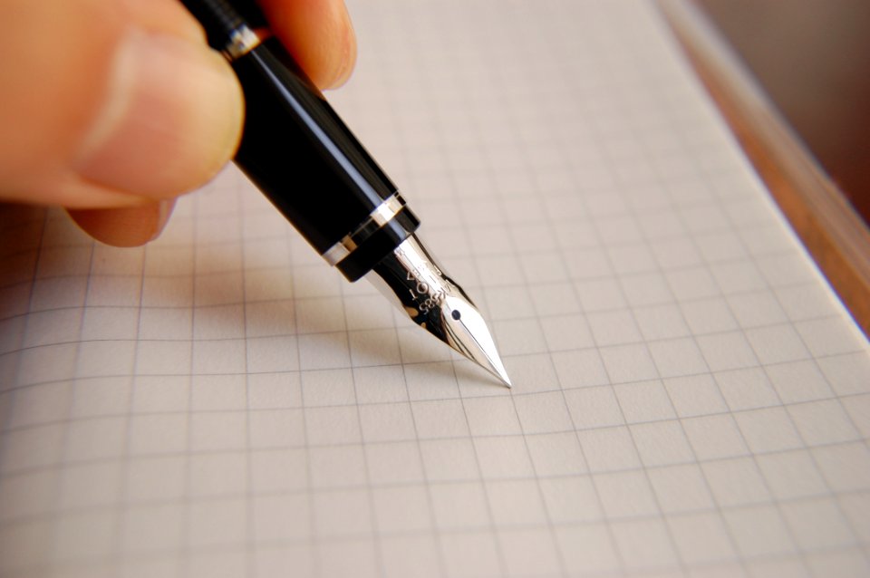 Person Writing With Fountain Pen
