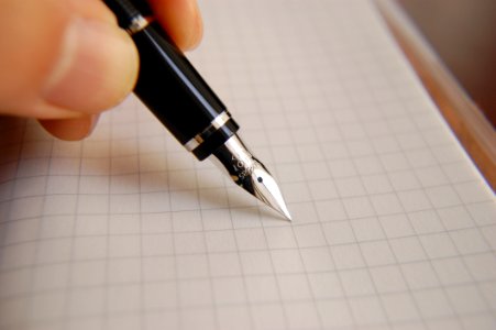 Person Writing With Fountain Pen