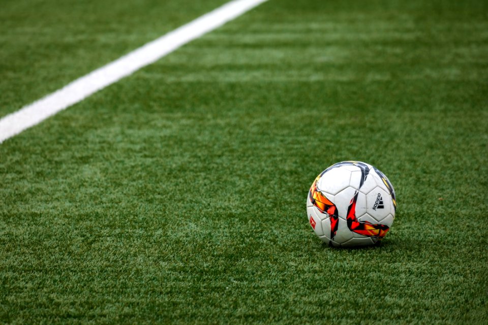 Football On Turf In Stadium