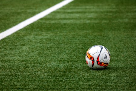Football On Turf In Stadium