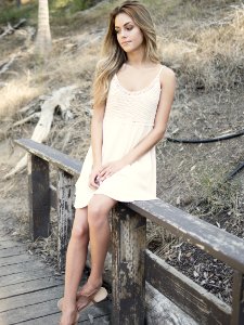 Woman On Wood Railing photo