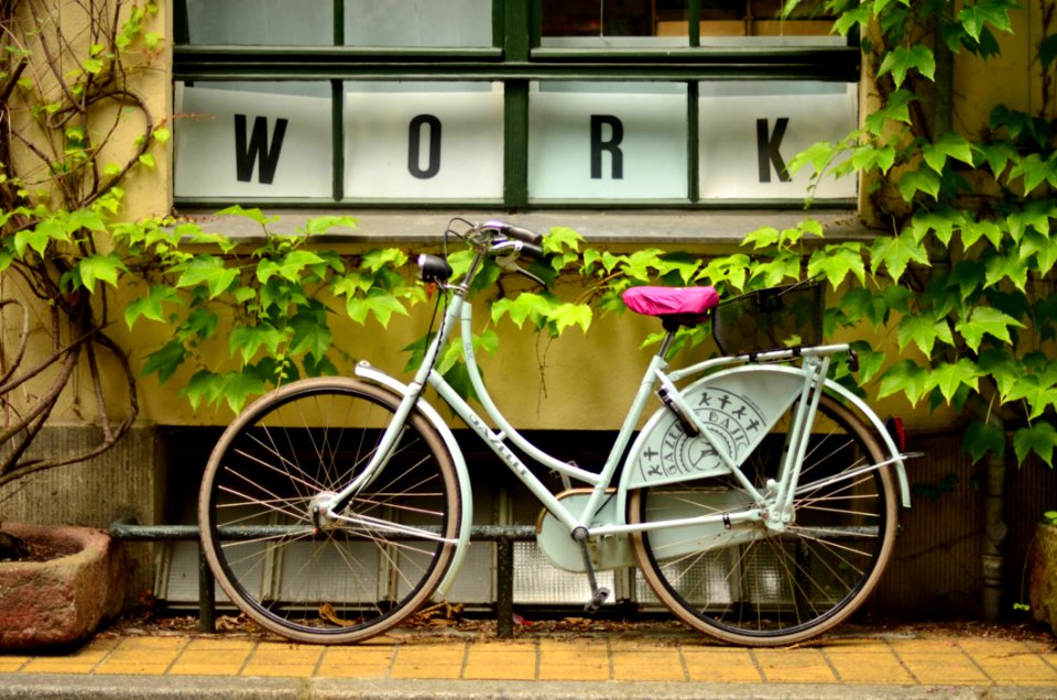 Bicycle Outside Window With Work Sign