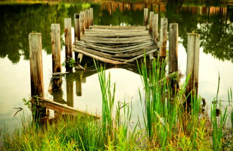Decayed Wooden Pier In Lake