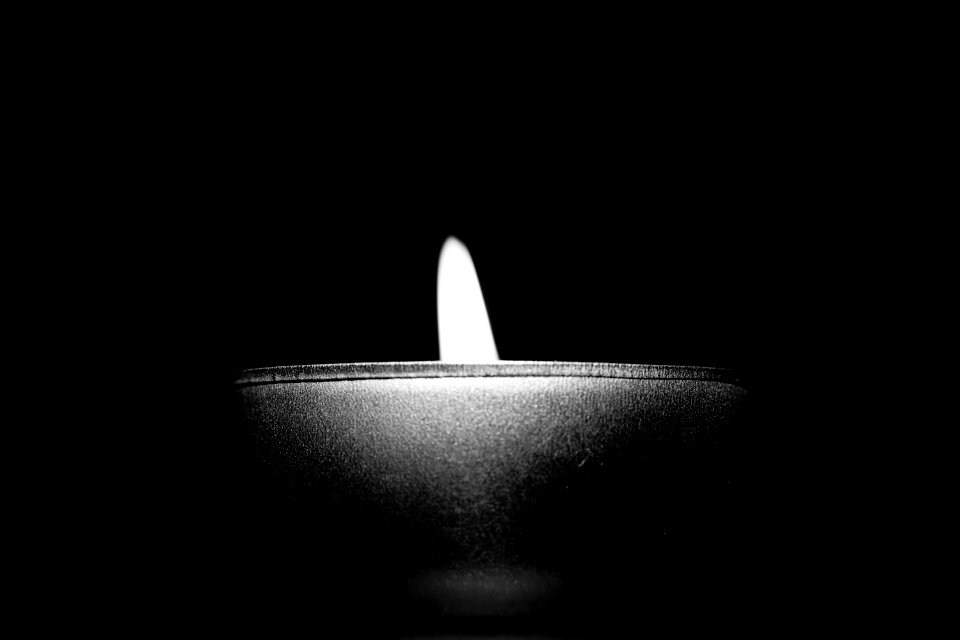 Close-up Of Candle Over Black Background