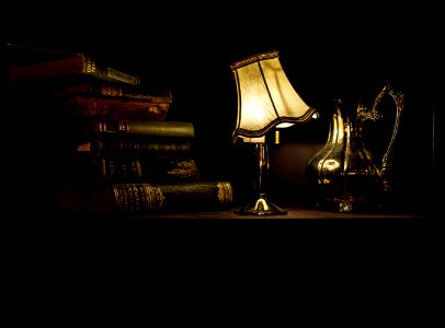 Desk With Lamp Pitcher And Vintage Books photo