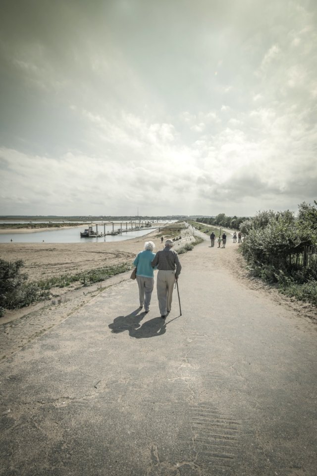 Elderly Couple Walking Together