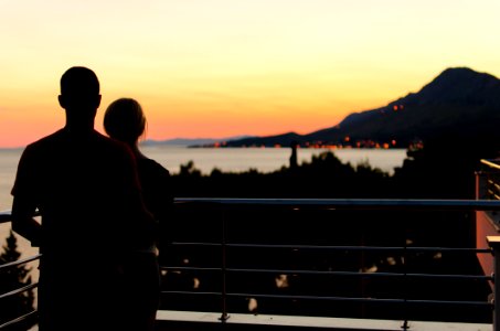 Silhouette Of Couple On Balcony