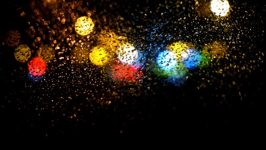Raindrops On Road Seen Through Car Window