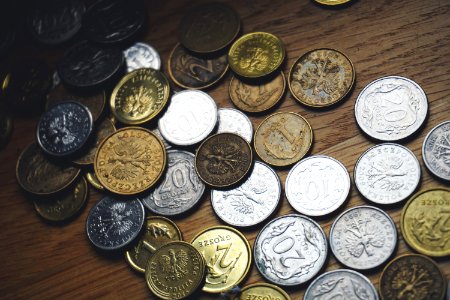 Close-up Of Coins On Table photo