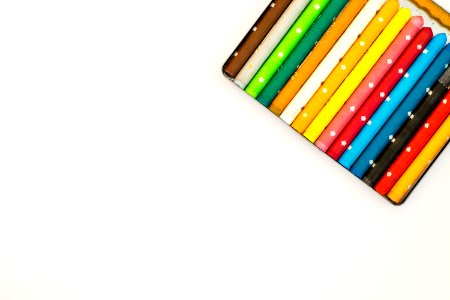 Multi Colored Pencils Over White Background photo