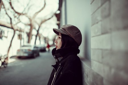 Young Woman Poses In Peak Cap
