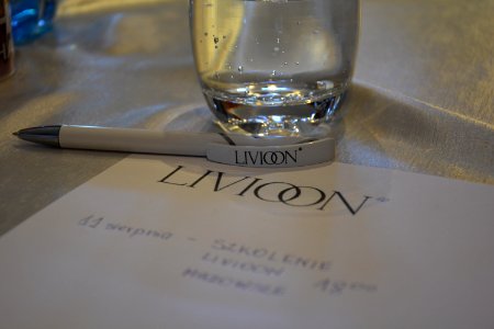 Paper And Pen With Company Logo And Glass Of Water photo