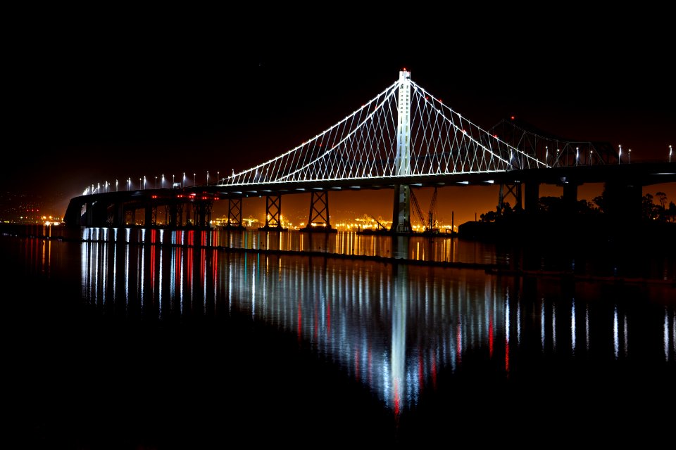 Illuminated Suspension Bridge Against Sky At Night photo