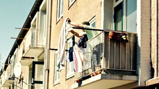 Low Angle View Of Clothes Hanging On Balcony photo