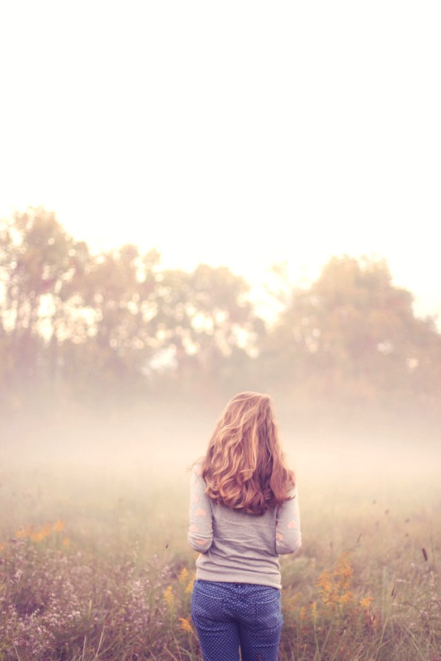 Woman Looking At View Of Landscape