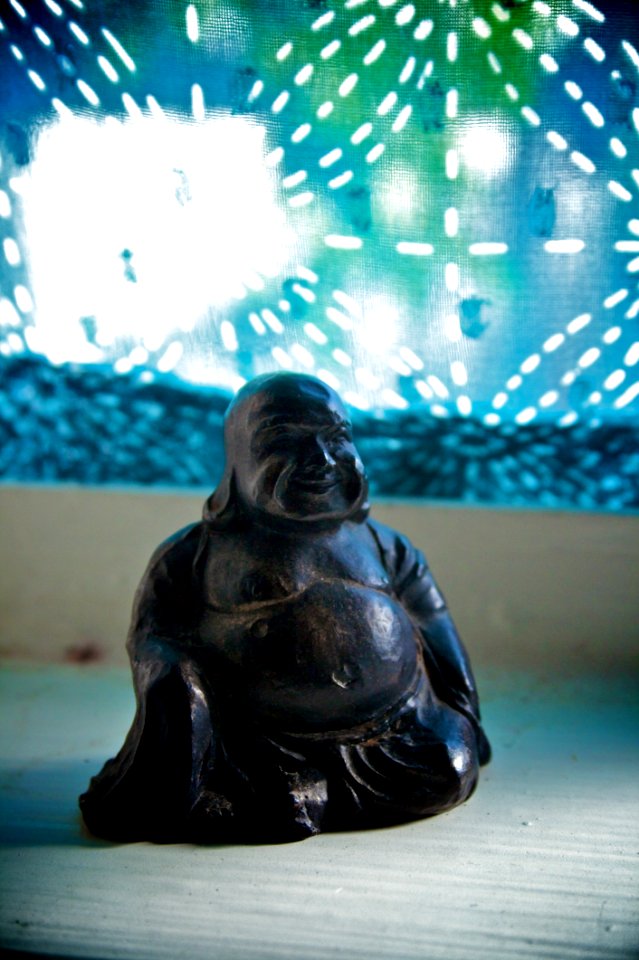 Little Buddha Statue In The Window